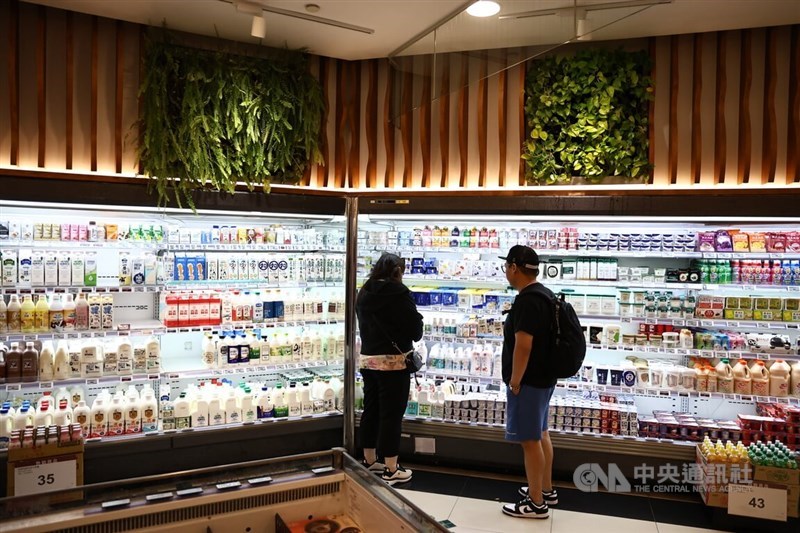 Shoppers browse food and drink items in a supermarket in Taipei Monday. CNA photo March 25, 2024