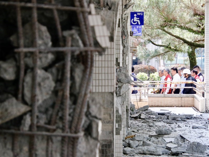 Premier Chen Premier (front, in red vest) and officials inspect the badly damaged buildings in National Hualien Girls' High School Thursday. CNA photo April 4, 2024